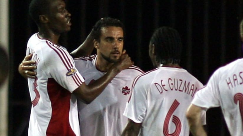 Dwayne De Rosario and Julian de Guzman with Canada.