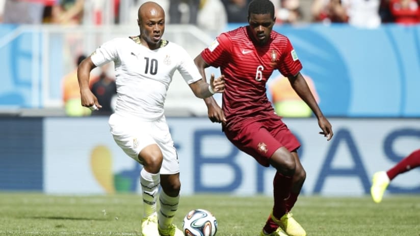 Andre Ayew from Ghana battles with William from Portugal