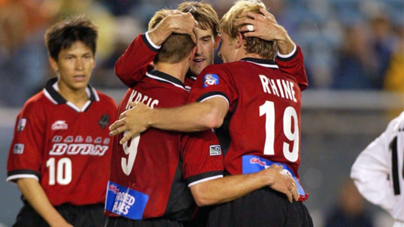 Dallas' Jason Kreis (left) and Bobby Rhine (right) celebrate with teammate Paul Broome.