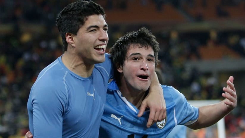 Nicolas Lodeiro, Luis Suarez - Uruguay - embracing during 2010 World Cup