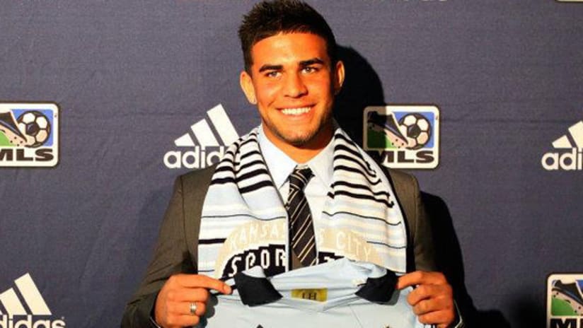 Dom Dwyer poses with Sporting Kansas City jersey after being taken with 16th pick in 2012 SuperDraft