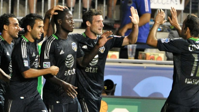 Eddie Johnson (center) celebrates his game-winning goal against Chelsea on Wednesday.