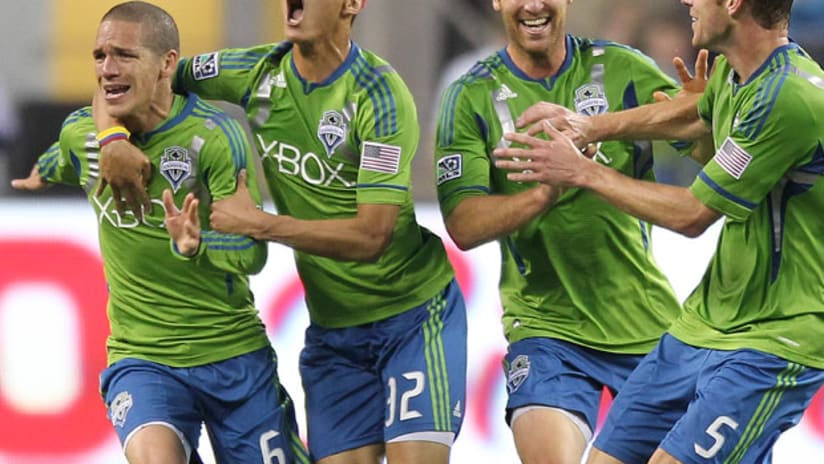 Seattle's Osvaldo Alonso celebrates his goal against Vancouver.