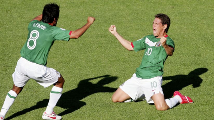Guillermo Franco and Pavel Pardo celebrate a goal for Mexico