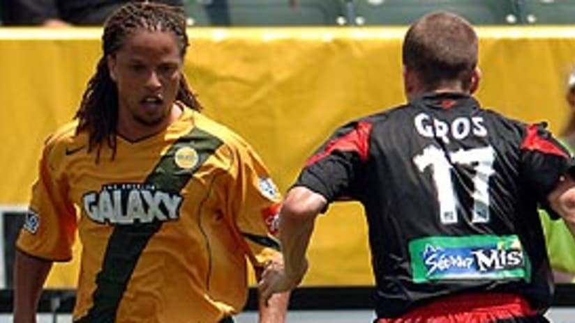 Cobi Jones (left) repeatedly tested D.C.'s Josh Gros along the right sideline.