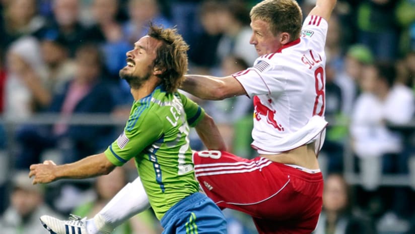 Seattle's Roger Levesque and New York's Jan Gunnar Solli vie for an aerial ball.