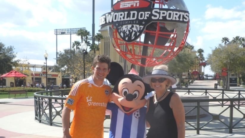 Bobby Boswell and his mother check in with Mickey Mouse.