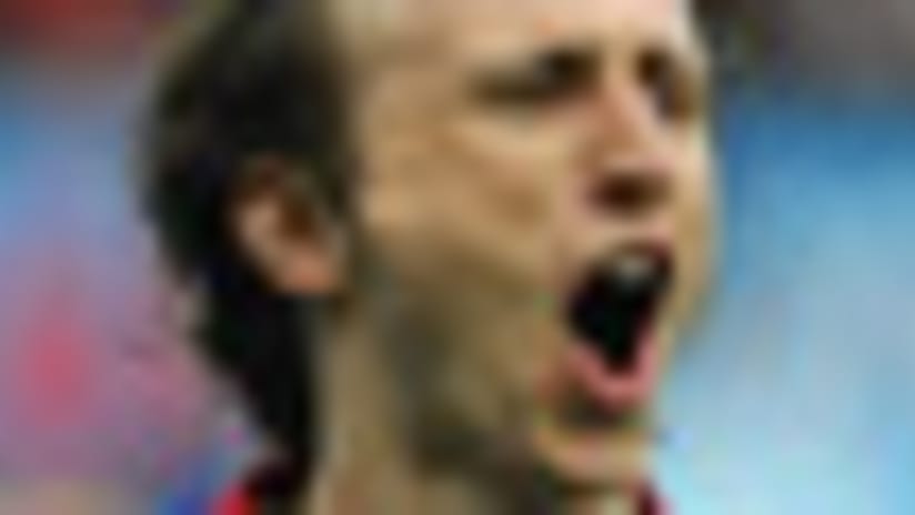 Croatian midfielder Luka Modric celebrates after scoring a penalty shot to defeat co-hosts Austria.