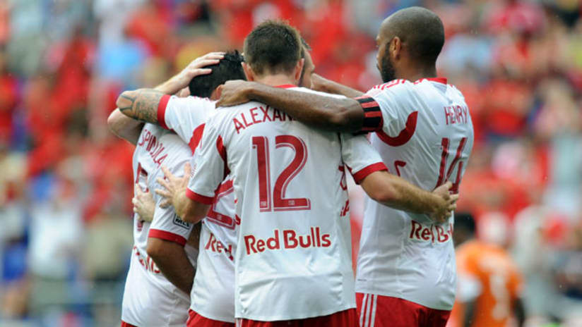 Fabian Espindola, Eric Alexander and Thierry Henry celebrate for the Red Bulls