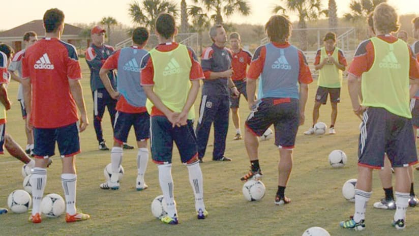 Fire coach Frank Klopas talks to his players during the team's preseason camp in Florida