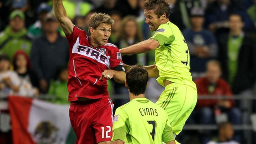 Chicago's Logan Pause goes up for a header against Seattle's Jeff Parke