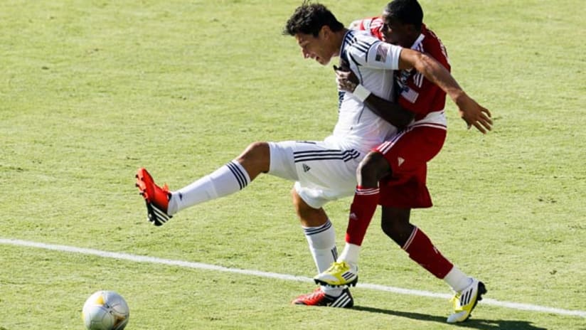 Omar Gonzalez and Jackson battle for the ball