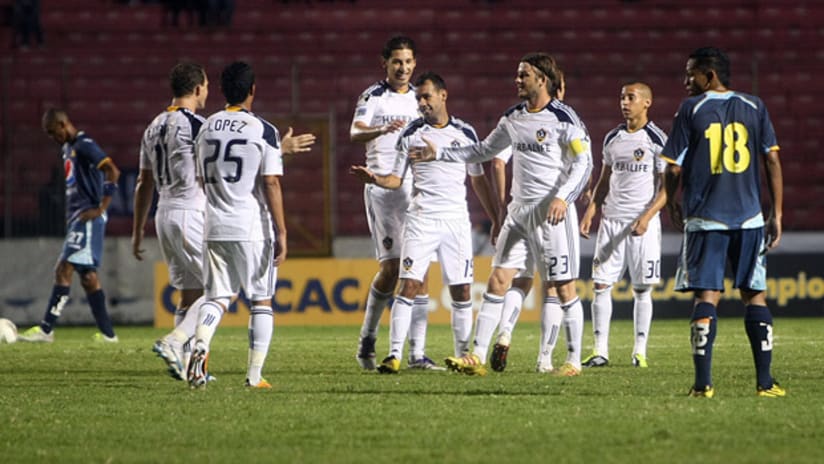 Juninho is congratulated by his Galaxy teammates after scoring vs. Motagua in CCL play