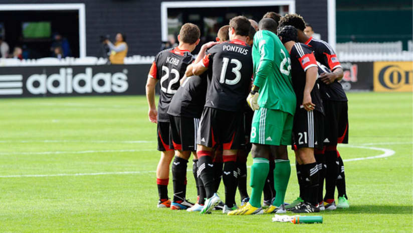 D.C. United players huddle up before playing soccer