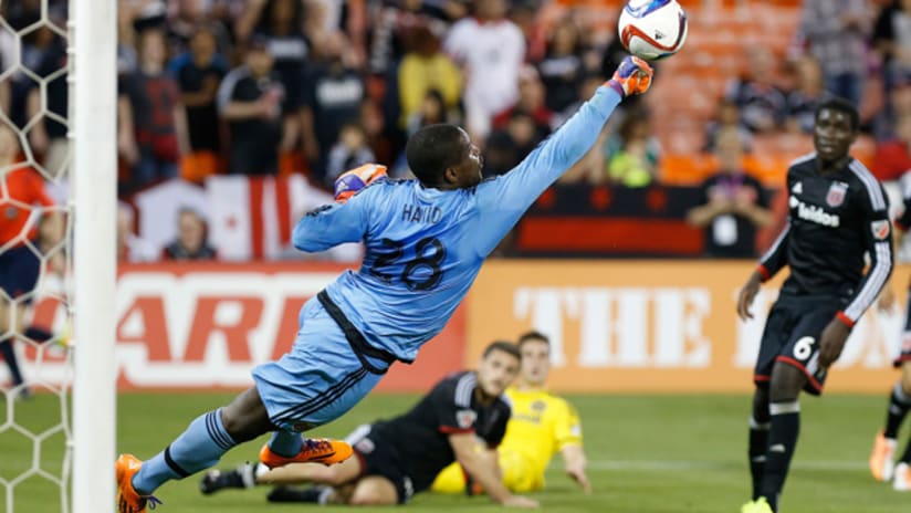 DC United 'keeper Bill Hamid goes full stretch to make a save vs. Columbus