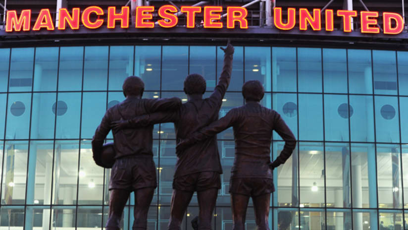 A statue at Old Trafford featuring George Best, Denis Law and Bobby Charlton