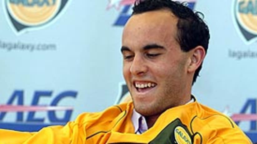 Landon Donovan pulls on his Los Angeles Galaxy jersey for the first time.