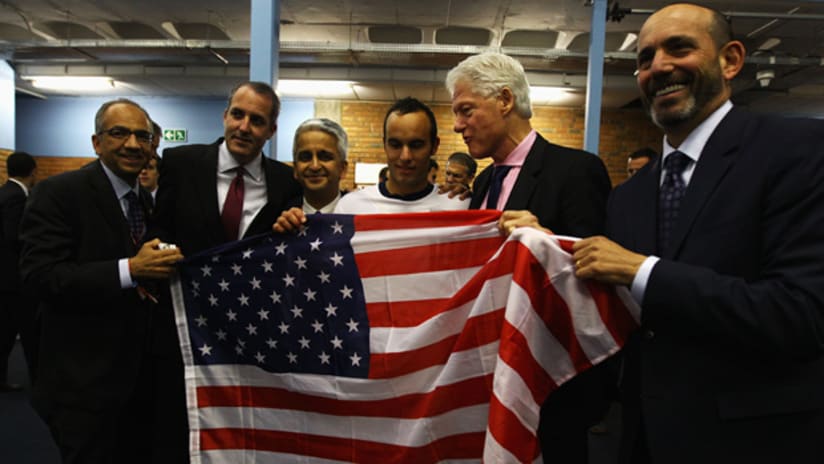 MLS Commissioner Don Garber joins former US President Bill Clinton for a photo following the US win vs Algeria