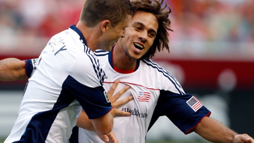 Revolution's Chris Tierney (left) celebrate his goal with teammate Kevin Alston.