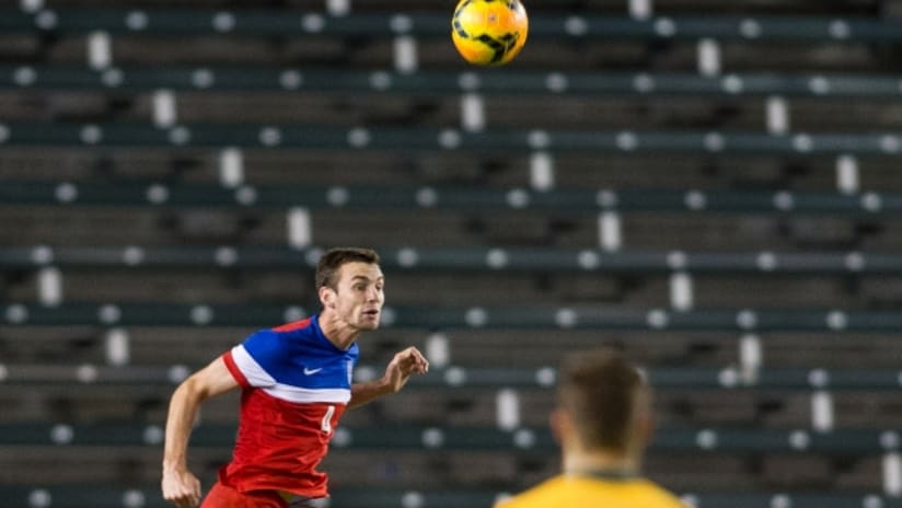 US U-20 international Conor Donovan heads clear against Australia in July 2014