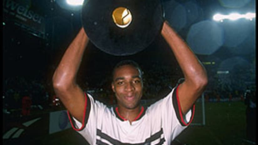 Eddie Pope holds the trophy aloft following D.C. United's MLS Cup win in 1996.