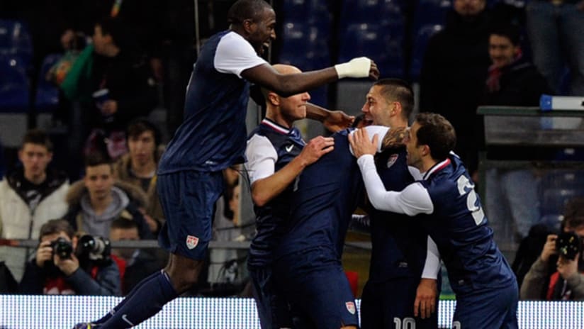 US attacker Clint Dempsey celebrates his goal vs. Italy with his teammates