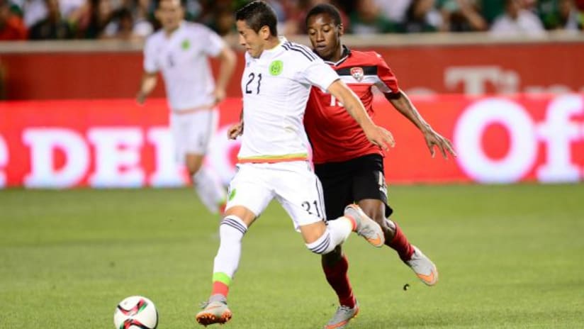 Carlos Esquivel (Mexico) and Cordell Cato (Trinidad and Tobago) in action during a friendly, September 2015