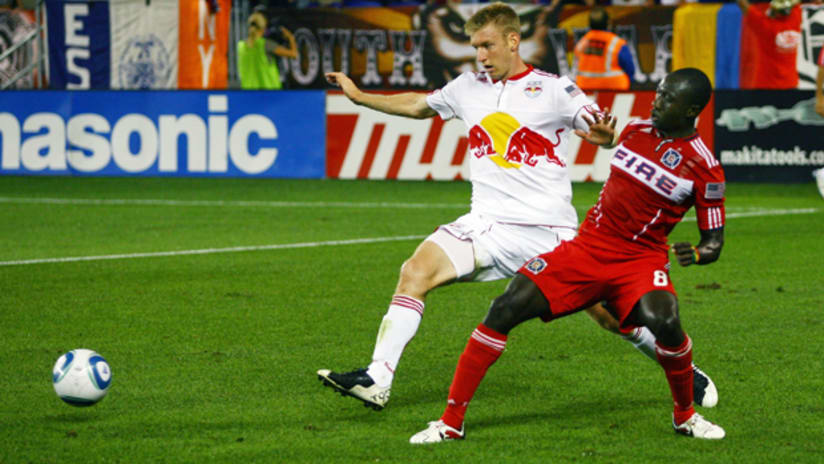 Tim Ream and Dominic Oduro battle for the ball in a 2-2 tie at Red Bull Arena.