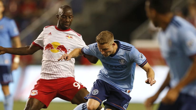 Bradley Wright-Phillips and Alex Ring battle for the ball