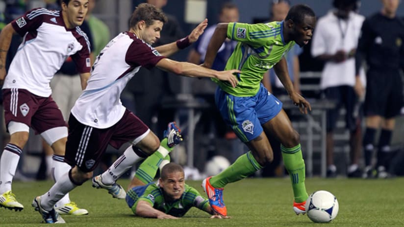 Colorado defender Drew Moor tries to keep Seattle's Steve Zakuani from getting by