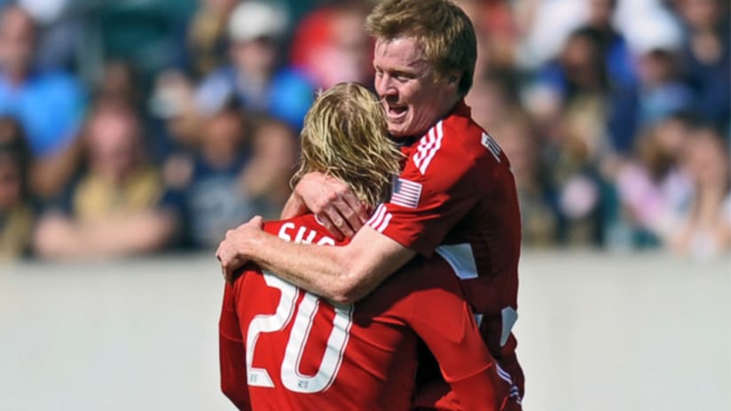 Dax McCarty celebrates with Brek Shea after Shea had put Dallas up, 1-0.