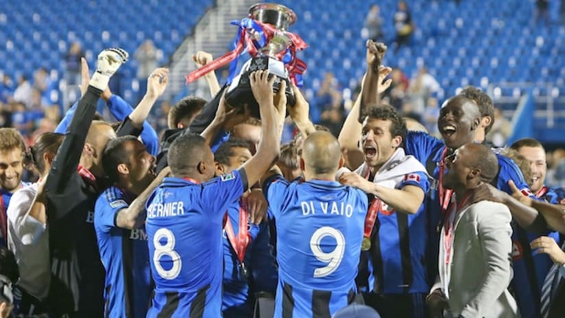 The Montreal Impact raise the Voyageurs Cup after winning the 2014 Canadian Championship