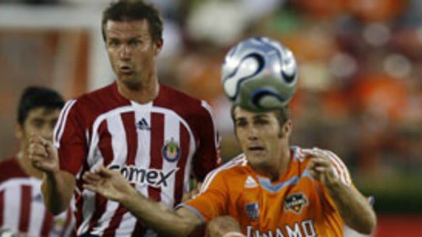 Brian Mullan (right) scored his first goal of the season to help get the rout of Chivas started.