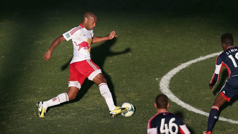 Thierry Henry dribbles on New England
