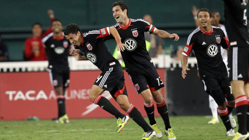 Lewis Neal and Chris Pontius celebrate a goal for D.C. United