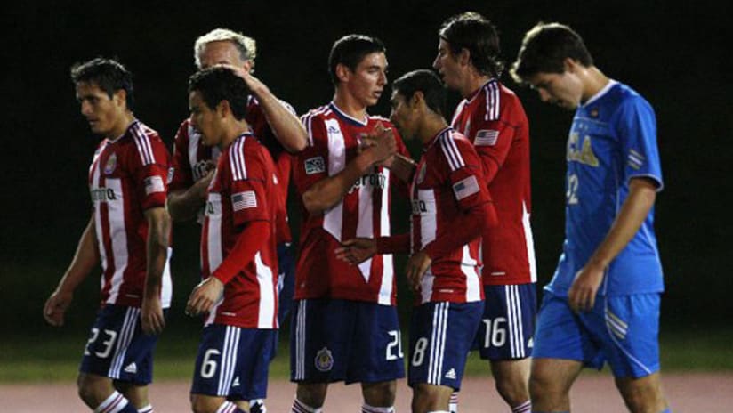 Chivas USA celebrate after Alan Gordon's third preseason goal