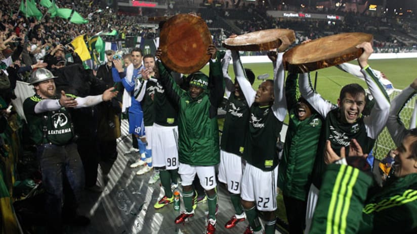 Timbers players celebrate in front of their fans.
