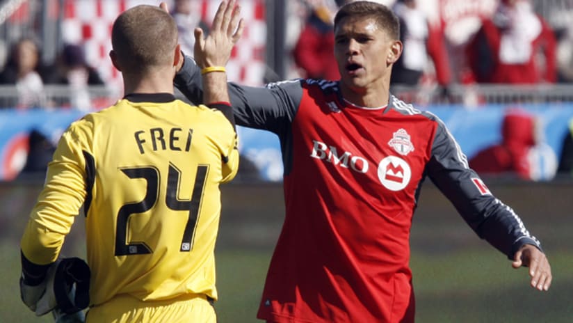 Stefan Frei and Adrian Cann celebrate Toronto FC's 2-0 win over the Portland Timbers