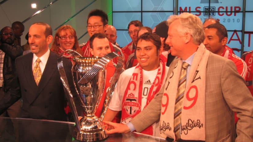 Commissioner Don Garber, Toronto's mayor and TFC fans pose with MLS Cup