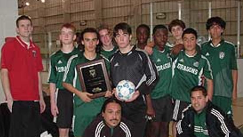 Josh Gros (left) with members of the U-14/U-15 Premier Division champion Dragons.