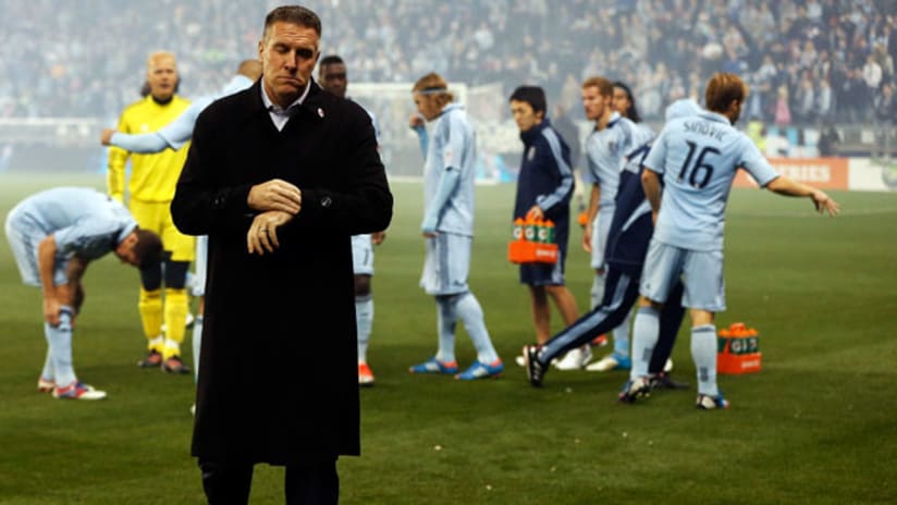 Sporting KC's Peter Vermes is dismayed after losing to Houston in the MLS playoffs.