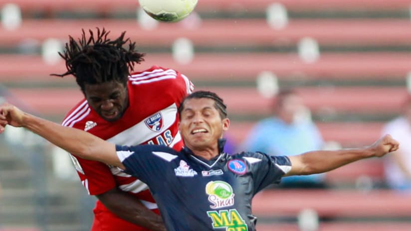 Ugo Ihemelu outjumps an Alianza player in FCD's win in CCL action.