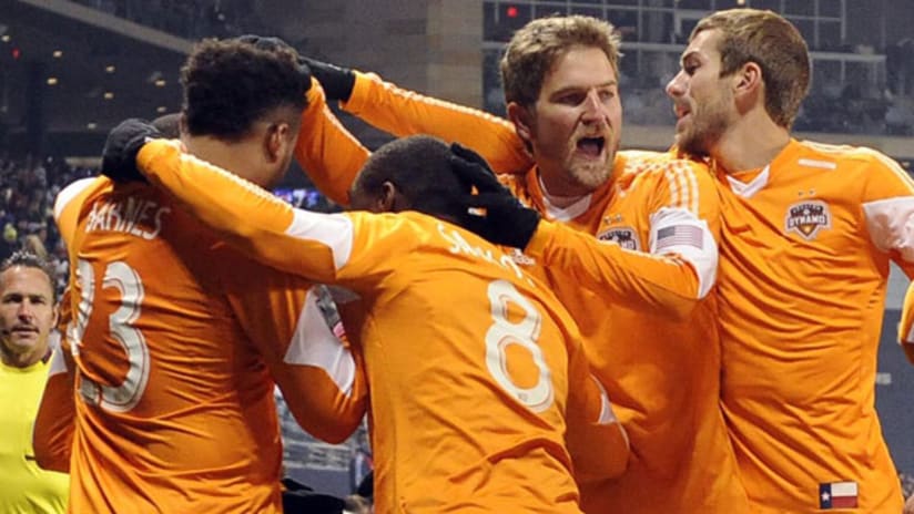 Houston Dynamo players celebrate a goal Saturday night vs. Sporting Kansas City