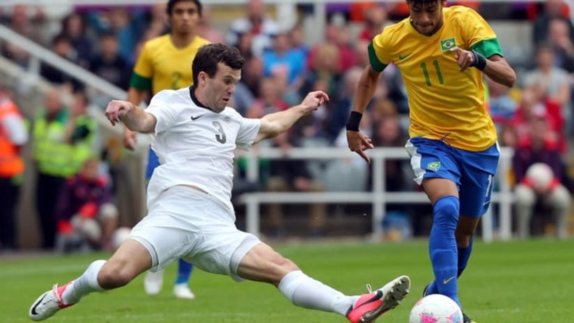 New Zealand's Ian Hogg goes in for a tackle on Brazil's Neymar at the 2012 Olympics.