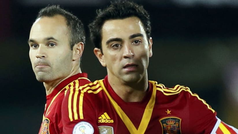 Spain's Xavi with Andres Iniesta in the background