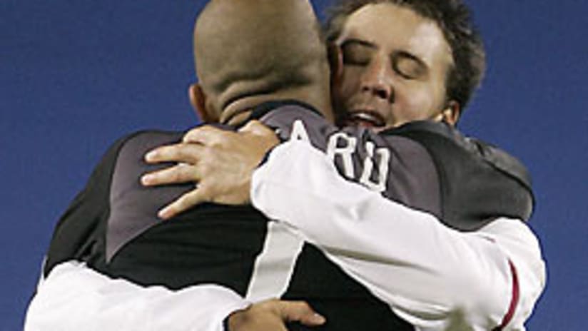 Defender Danny Califf hugs goalkeeper Tim Howard after the U.S. win Wednesday.