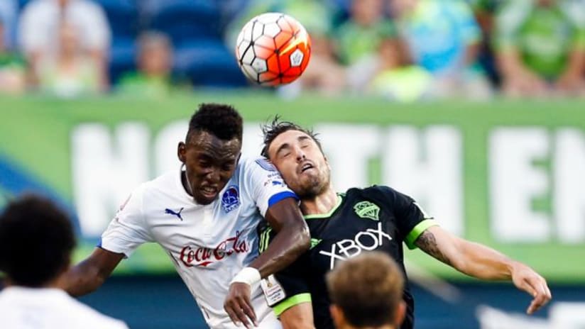 Jimmy Ockford (Seattle Sounders) contests a header, 2015-16 Champions League