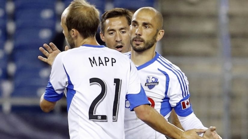 Marco Di Vaio and Justin Mapp celebrate a goal against New England