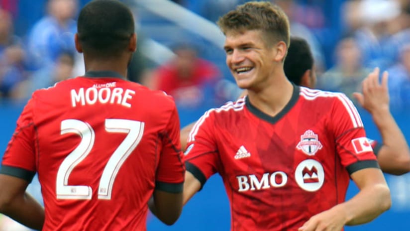 Hagglund and Moore celebrate something for TFC