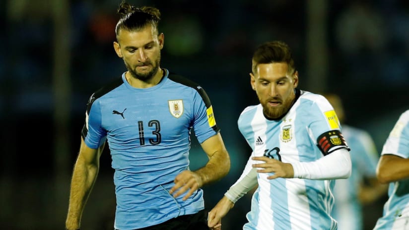Gaston Silva for Uruguay against Lionel Messi, Argentina
